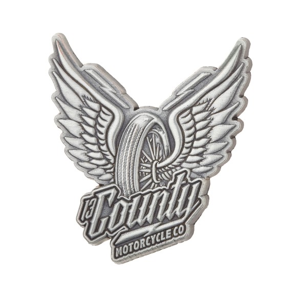 A patch featuring a motorcycle tire with angel wings.